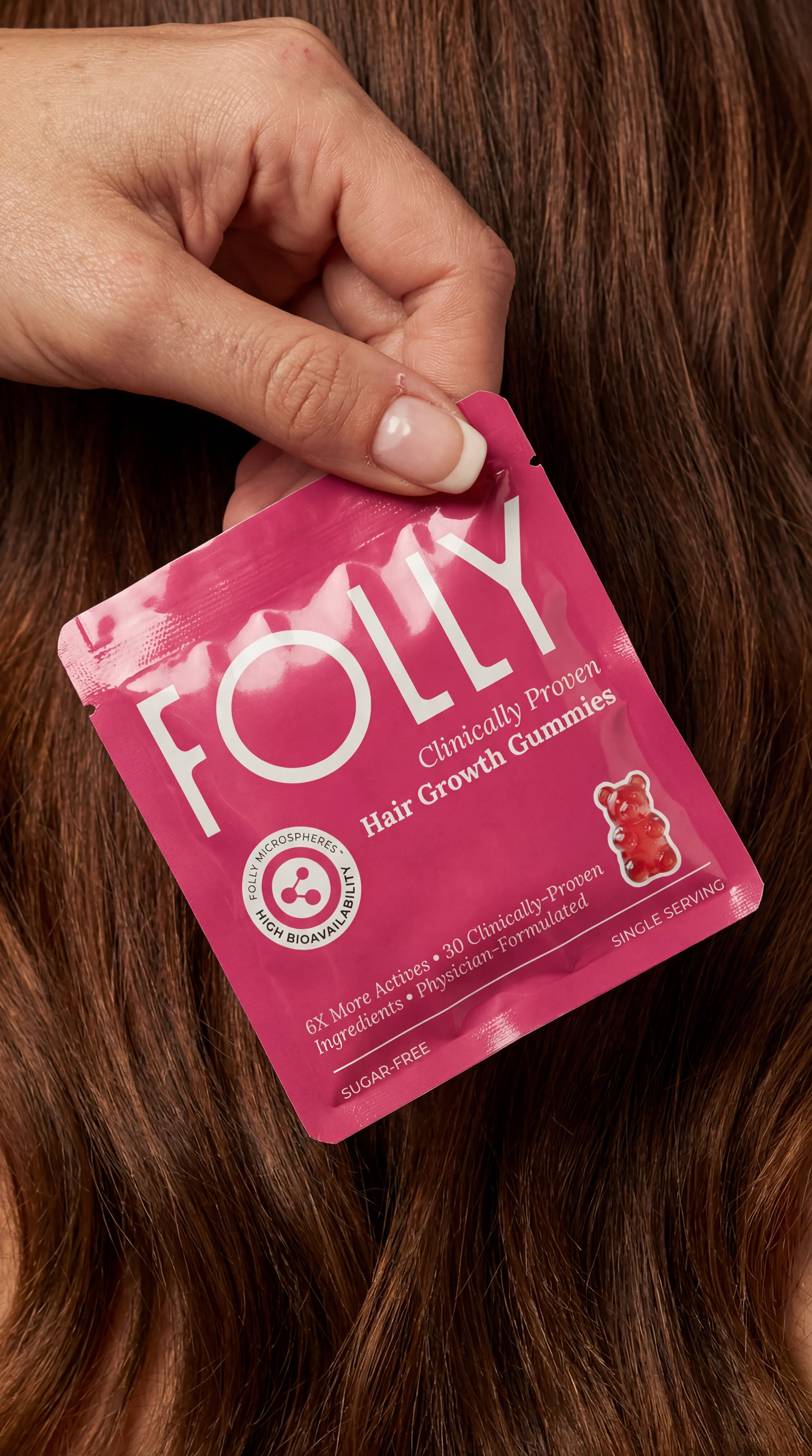 Folly sachet photographed against hair